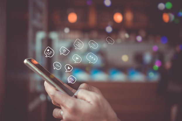 person on phone using social media