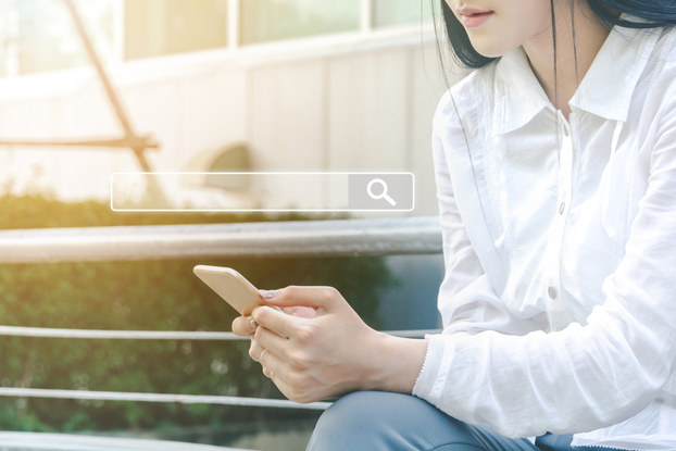 woman searching on smartphone