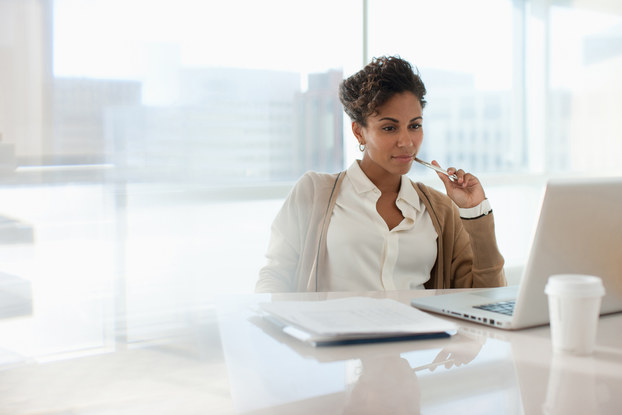 professional woman looking at laptop screen