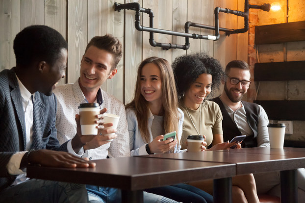 group of millennials in coffee shop