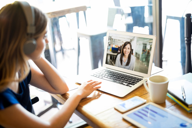 woman web conferencing on laptop