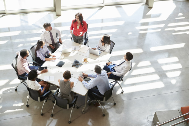 team of coworkers sitting around a table