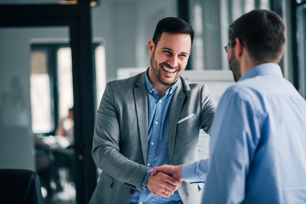 two men shaking hands