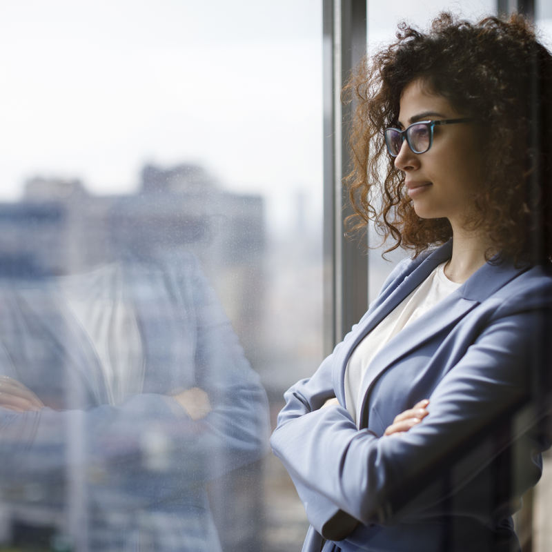 professional woman looking out window