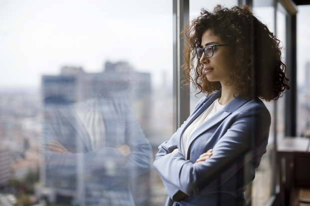 professional woman looking out window