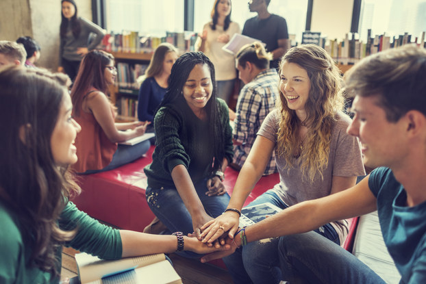 group of young friends inside bookstore