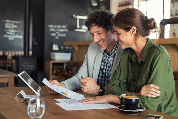 two business partners going over charts