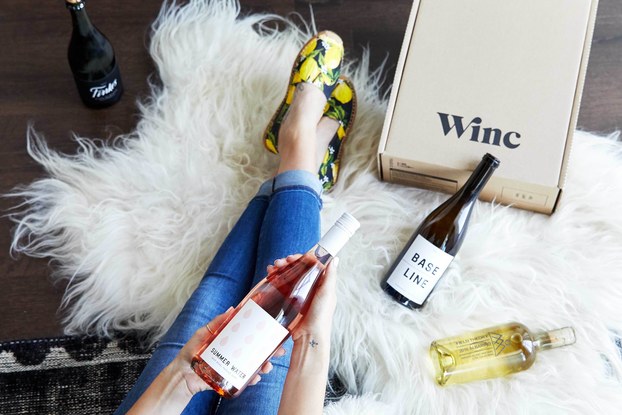 woman unboxing her winc wine box