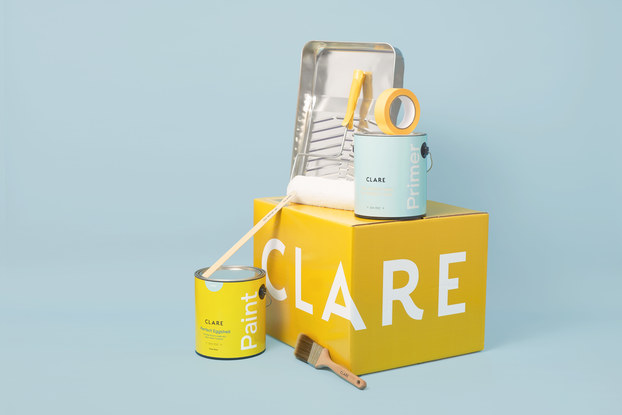 clare product display with box and paint cans and materials