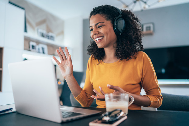 woman at home on video call through computer
