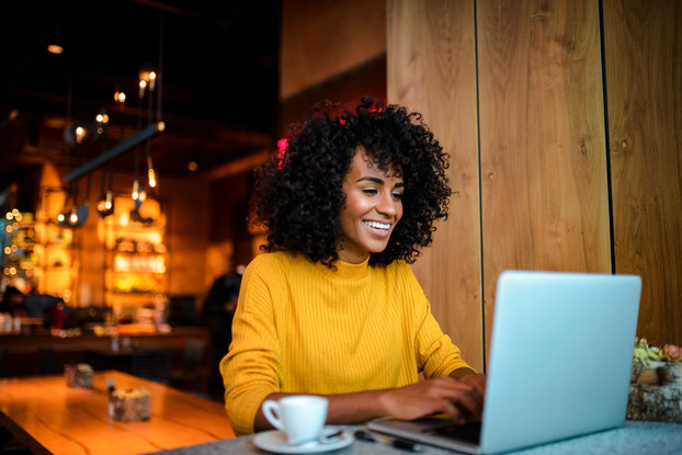 woman smiling at laptop