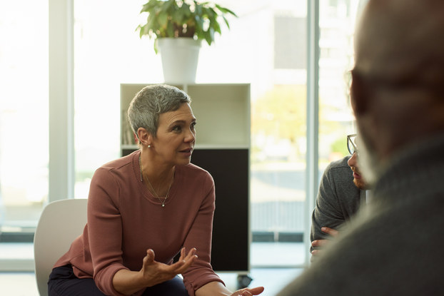 woman negotiating with others