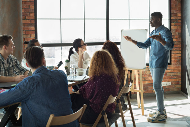 boss presenting to team of employees