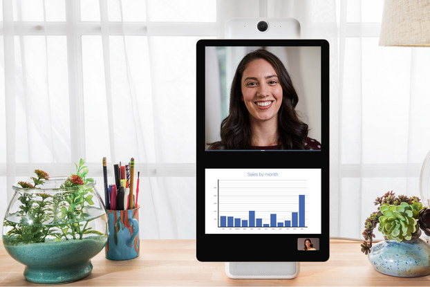 Workers collaborating on tablet via Facebook Workplace