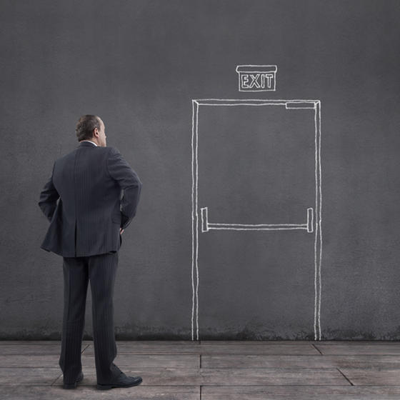 Man staring at exit door