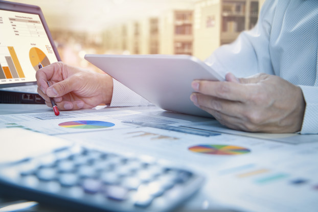Person working on color charts on desk top