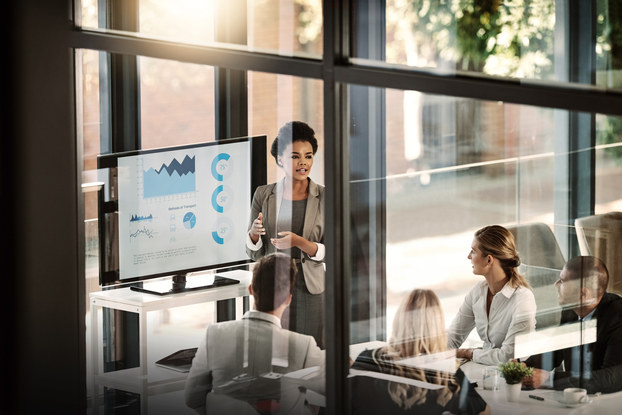 Woman leading meeting with charts