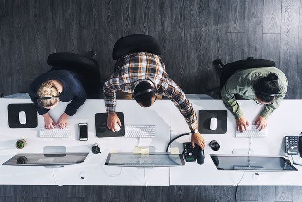 Overhead shot of employees at desk