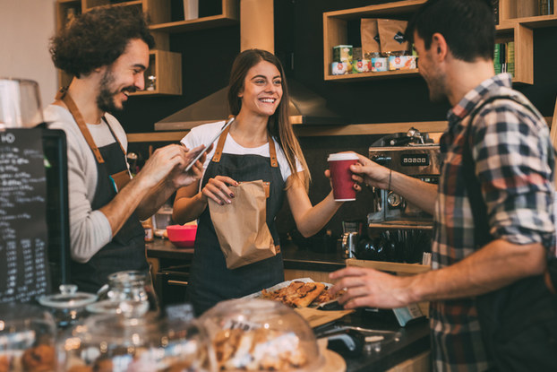 Customer and employees in coffee shop