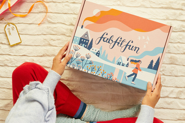 person opening fabfitfun winter box