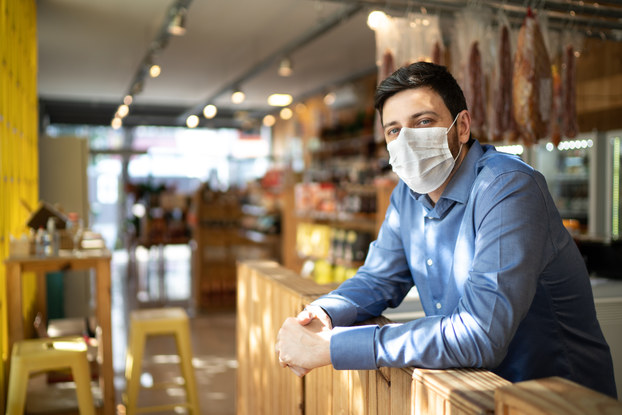 small business owner wearing mask