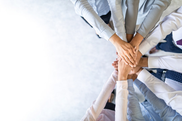 hands all together in a circle