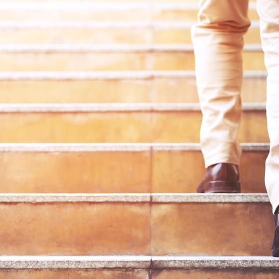 man walking up stairs