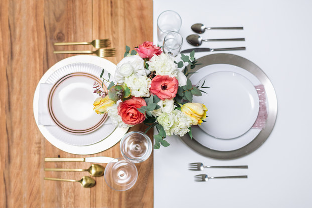 bloomerent flowers on two table settings