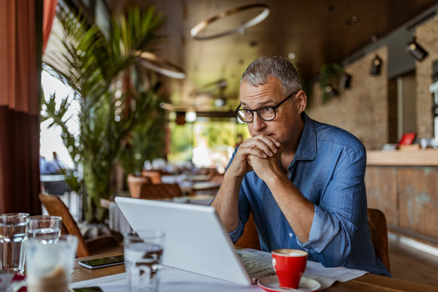male business owner sitting at table