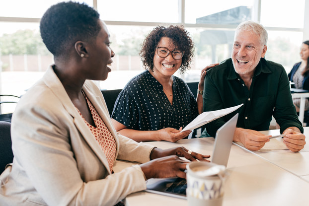 three people having a meeting