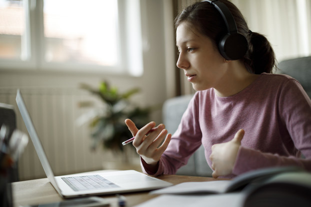 Worker negotiates promotion on video call.