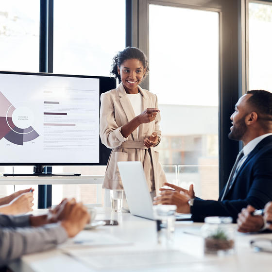 woman giving presentation to coworkers