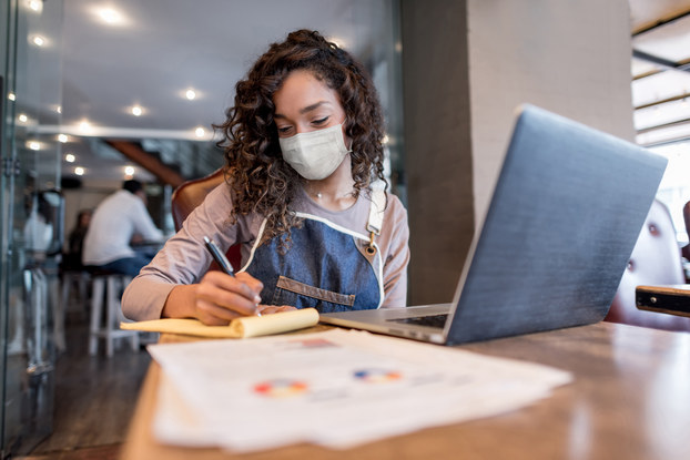 woman doing business with mask on