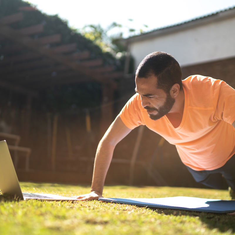 man outside doing virtual workout