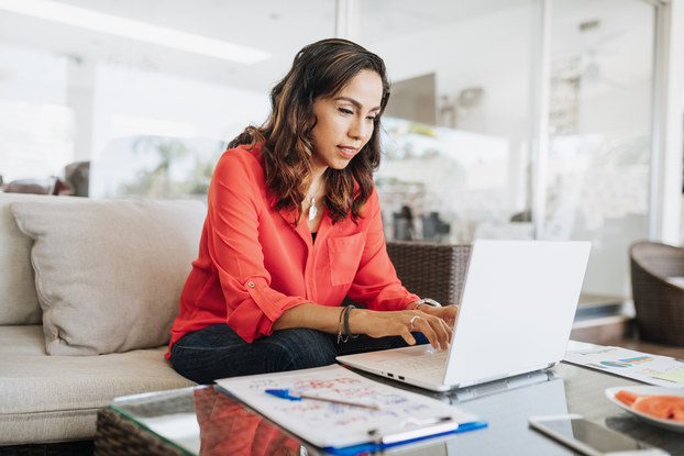 woman working on laptop at home