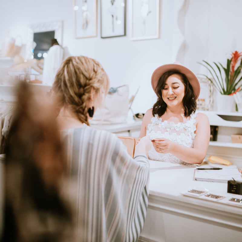 woman paying for her purchase at a boutique