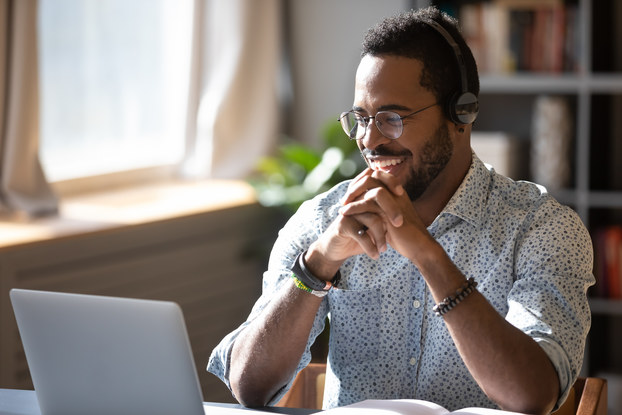 Many smiling on phone with headset