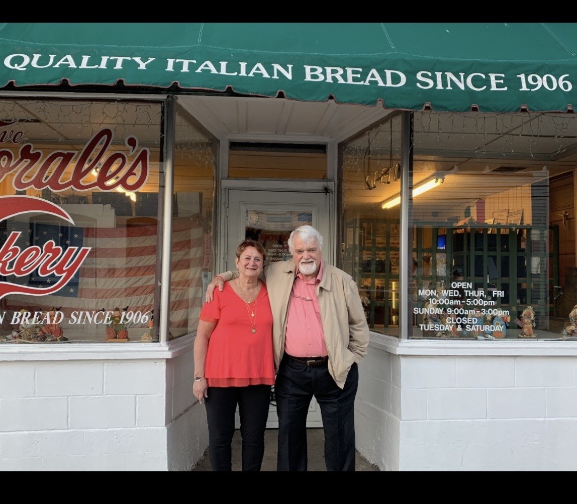 Gus and Cindy Caporale, the third generation owners of Caporale's Bakery in Cumberland, Md., standing in front of their bakery.