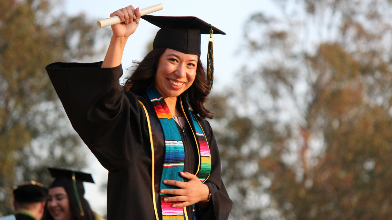 Yellow Arrow Collective Programs for College and High School Students College student graduating free of stress & anxiety