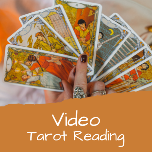 Tarot cards in a hand - Video Tarot Reading