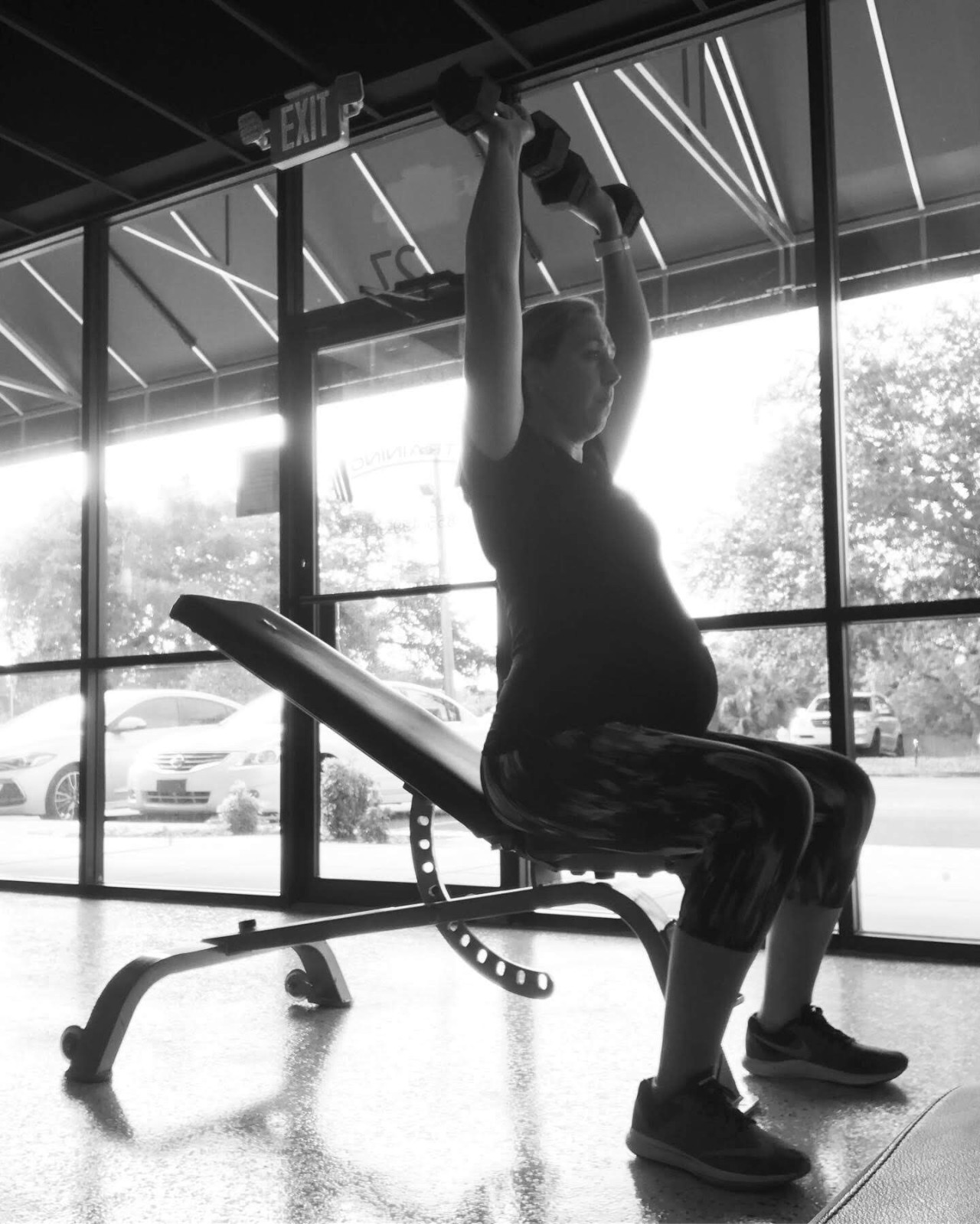 A Pregnant Female Lifting Weights