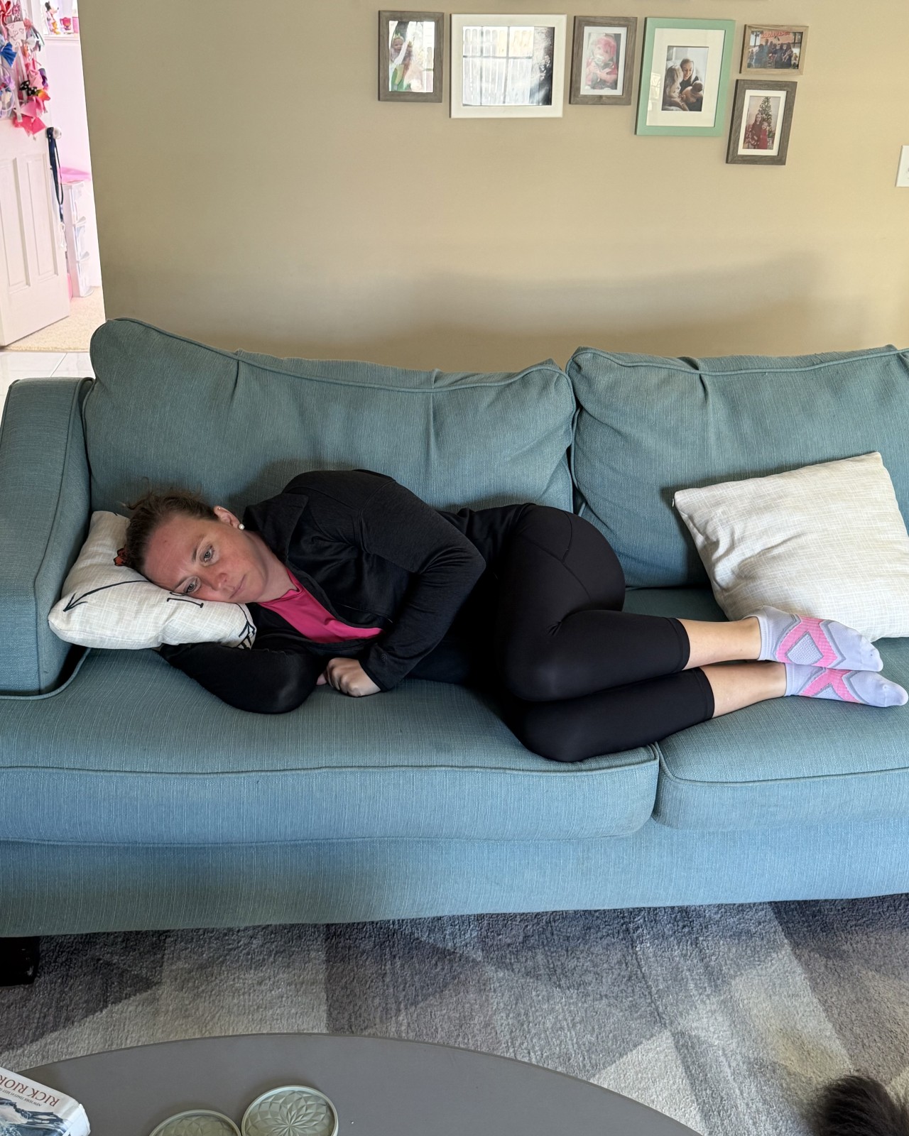 Jen of Moms Fit Life Demonstrating how to lay on your side to show a better way to prepare for labor