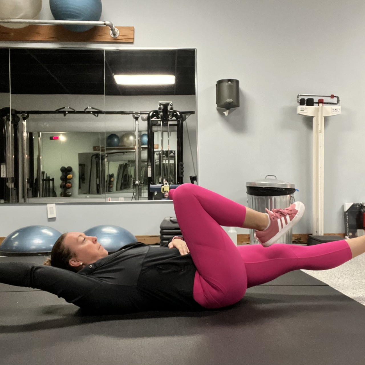 Female laying on back with opposite limbs extended.