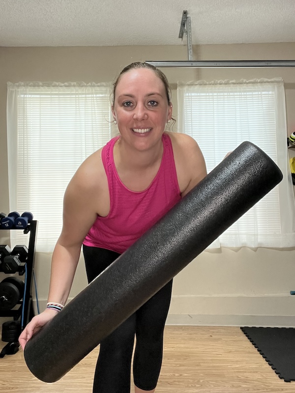 Female holding a foam roller
