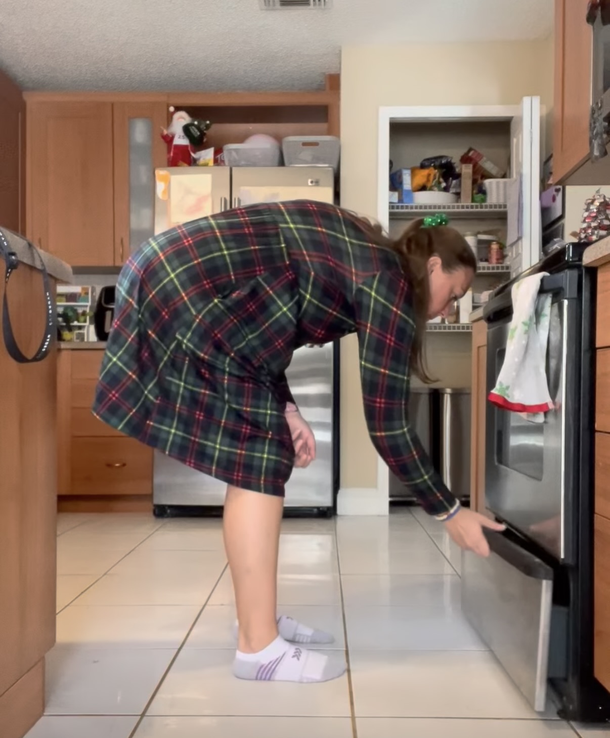 a mom rounded getting something out of the oven warmer