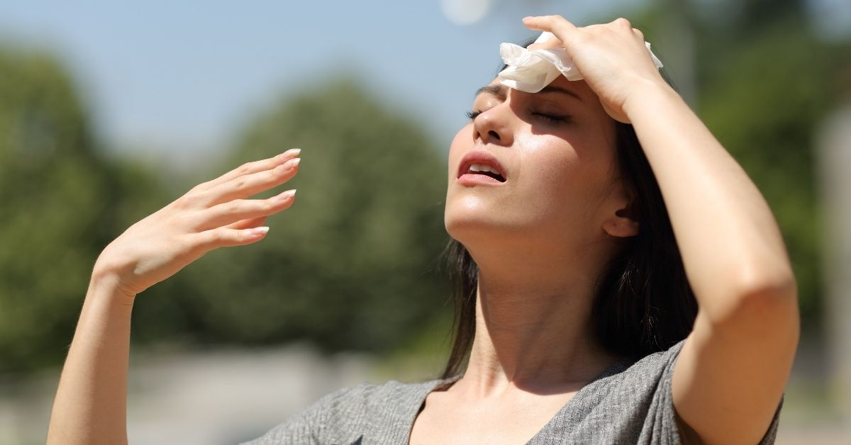 A woman experiencing dehydration and its impact on Irritable Bowel Syndrome