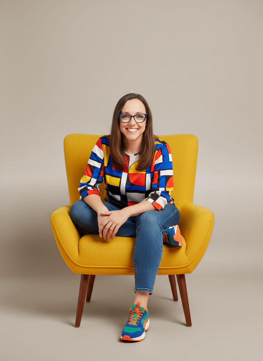 woman in colorful shirt sitting on yellow chair