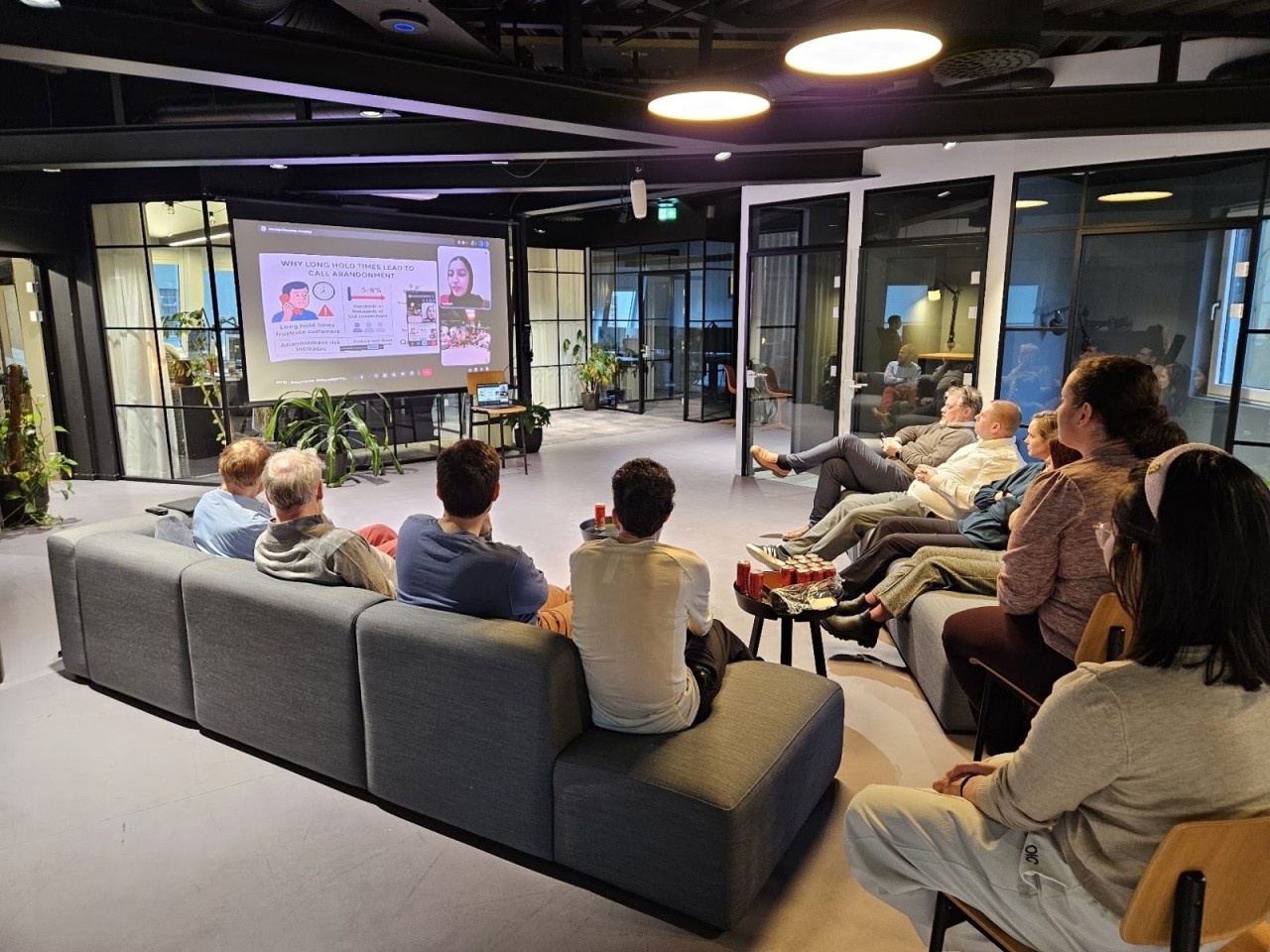 The AI meetup in Bergen, guests watching a presentation on a large screen