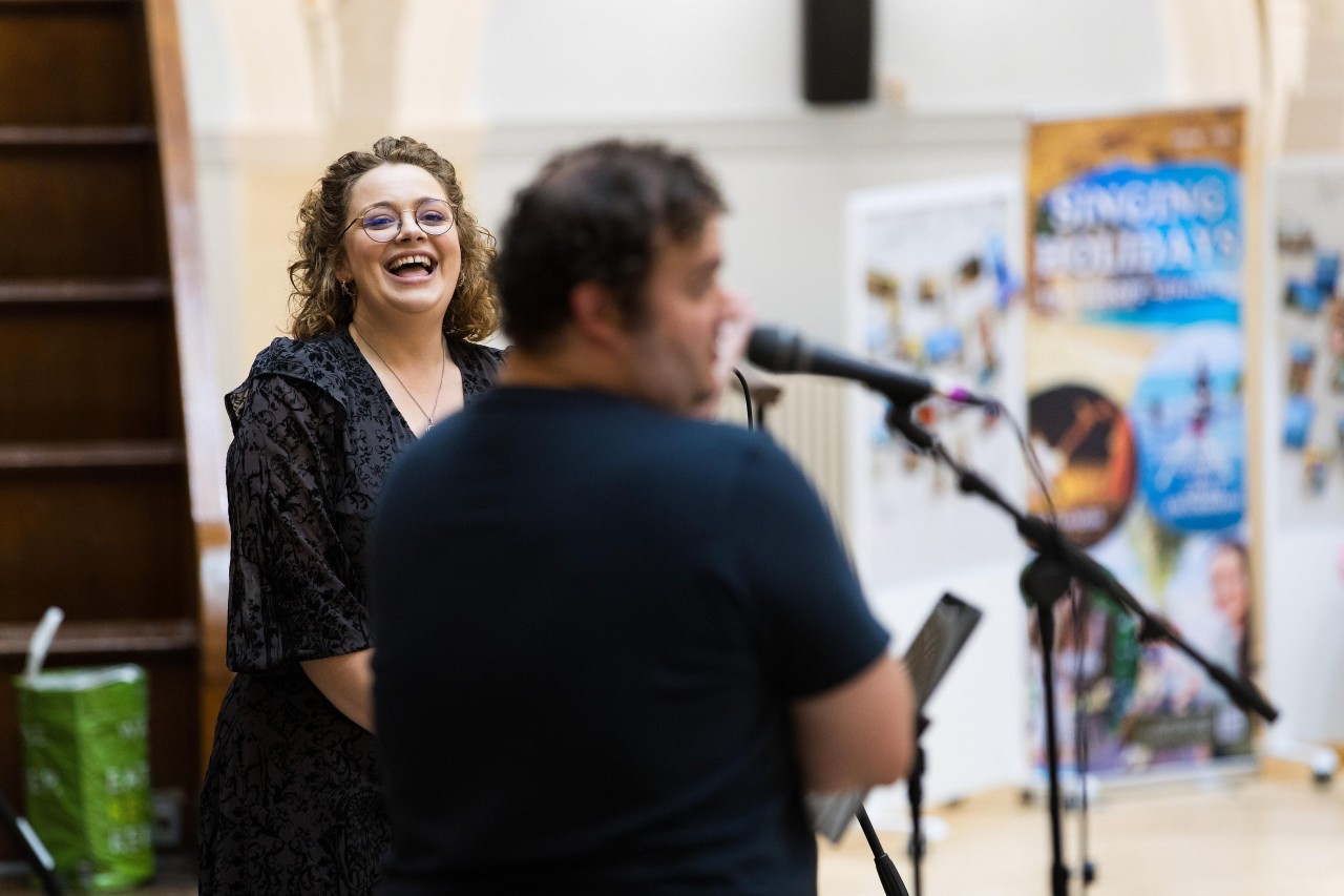 Choir members enjoying a rehearsal