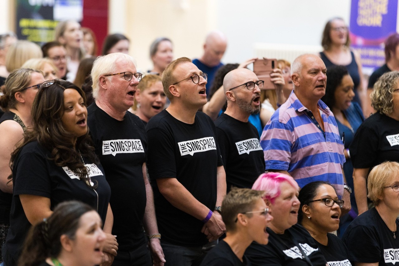 Sing Space choir members singing together